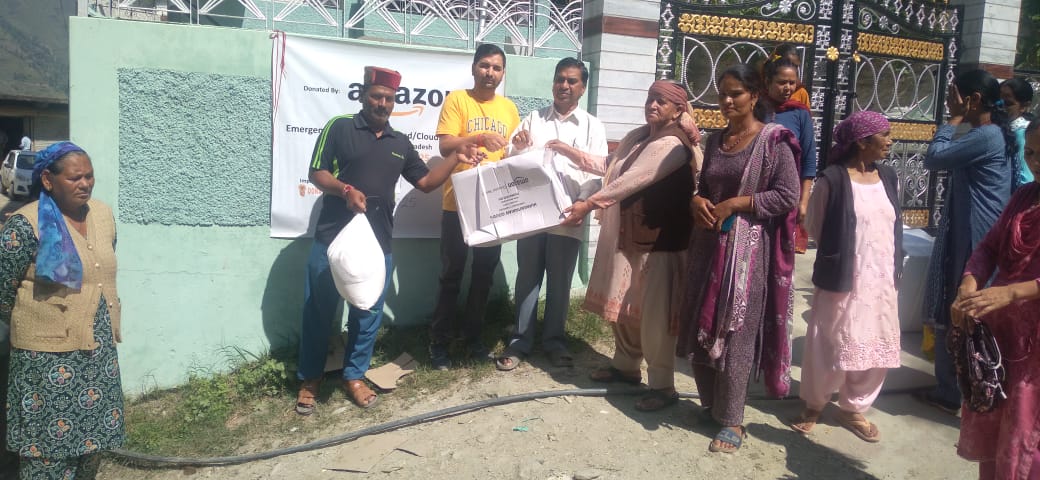 Volunteers and Panchayat members during distribution